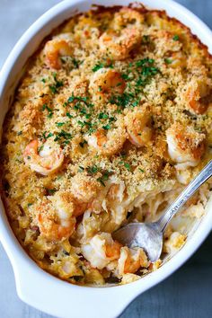 a casserole dish with shrimp and cheese