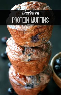 blueberry protein muffins stacked on top of each other