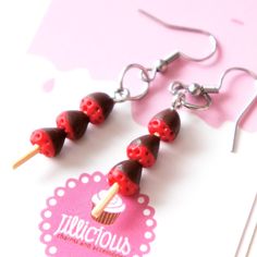 red and black candy lollipops on wooden stick earrings