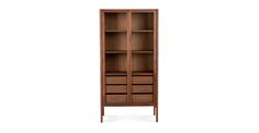 a tall wooden bookcase with drawers on one side and an open drawer on the other