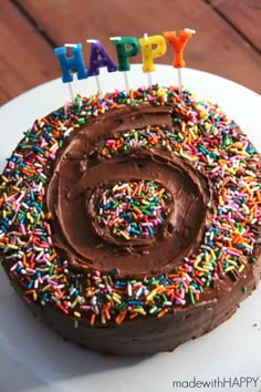 a birthday cake with chocolate frosting and sprinkles