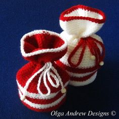 two crocheted red and white baby booties on a blue background with the words pattern written below