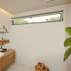 a bathroom with a sink, mirror and window in it's centerpieces