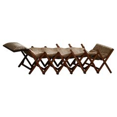 four wooden folding chairs sitting next to each other