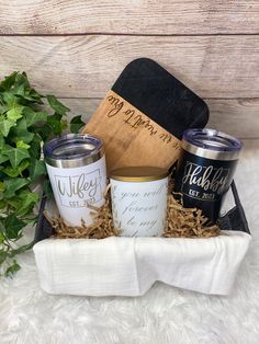 the gift basket includes two mugs and a cutting board