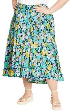 A captivating print and ankle-grazing hem add eye-catching elements to a flowy skirt fitted with a smocked waist for comfortable wear. 38 1/2" length Smocked waist 100% viscose Machine wash, line dry Imported Floral Print Flowy Skirt, Spring Tiered Maxi Skirt In Rayon, Spring Rayon Maxi Skirt With Ruffles, Spring Ruffle Rayon Maxi Skirt, Flowy Floral Print Skirted Bottoms, Spring Ruffled Rayon Maxi Skirt, Beach Rayon Tiered Skirt, Rayon Tiered Skirt For Beach, Rayon Tiered Skirt For The Beach