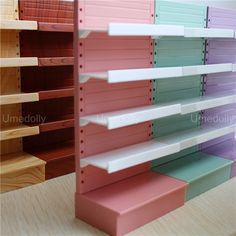 several shelves with different colors and sizes on them