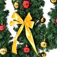 a christmas tree with ornaments and a yellow bow on it's side, in front of a white background