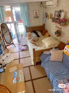 a messy bedroom with stuffed animals on the bed and other items in the room around it