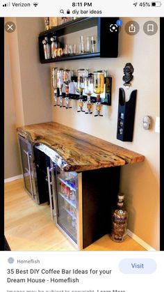 a wooden counter top sitting in the middle of a room next to shelves filled with liquor bottles