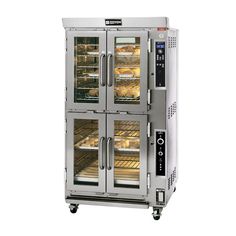 two double door ovens with trays full of donuts on the front and bottom