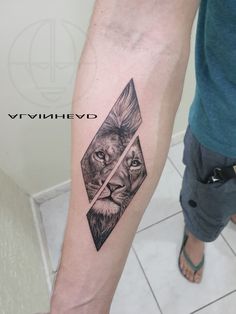 a man with a lion tattoo on his arm