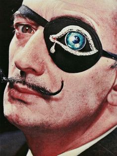 a close up of a man with eye patch on his face and an evil looking eyeball