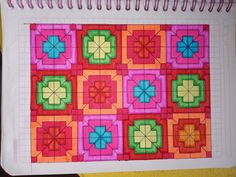 a piece of paper that has been made into a quilt with squares and flowers on it