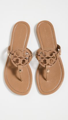 Upper: CowhideLogo cutoutFlat profileRubber soleDust bag includedImported, BrazilThis item cannot be gift-boxedFlip-flopsOpen toeStyle #TORYB50453 Soft Sandals, Pretty Sandals, Tory Burch Miller Sandals, Miller Sandal, Tory Burch Sandals, Tory Burch Miller, Mule Sandals, Tory Burch Flats, Sandals Brands