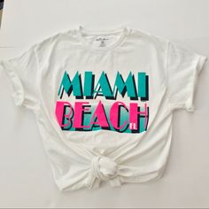 Cute Miami Beach Graphic Tee Brand New! So Much Versatility-Pair With A Fun Skirt, Short Shorts, Or Mom Jeans Or Cut It Up To Make Alterations For This Heat Wave Size M Bust : 39” Shoulders : 17.75” Sleeve 15.25” Length 26.5” This Heat, Skirt Short, Cut It, Short Shorts, Miami Beach, Pink White, Graphic Tee, Mom Jeans, Miami