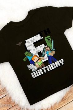 a black shirt with the number six on it and minecraft characters printed on it