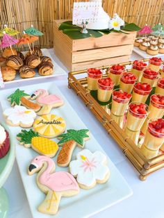 an assortment of decorated cookies and desserts on a table