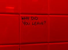 a red wall with writing on it that says why did you leave?