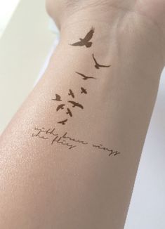 a woman's arm with birds on it and the words to heaven written in cursive ink