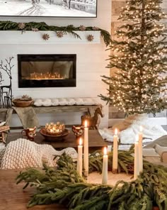 a living room decorated for christmas with candles