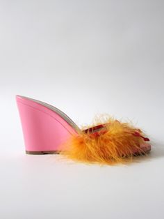 nappa leather upper faux feather detail leather outsole wedge mule approx 85mm/ 3.35 inch heel made in Italy Pink Leather Open Toe Wedge Sandals, Chic Orange Open Heel Mules, Orange Leather Open Heel Mules, Orange Fur Heels, Pink Mules With 4-inch Open Heel, Vegan Design, Wedge Mules, Leather Bow, Leather Bows