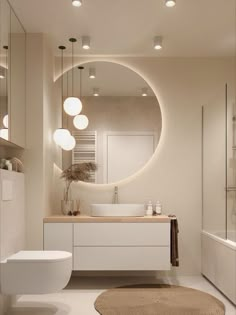 a bathroom with a round mirror above the sink and a rug on the floor next to it