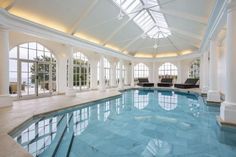 a large indoor swimming pool in the middle of a living room