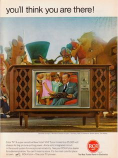 an old television with the image of two people on it and children sitting in chairs