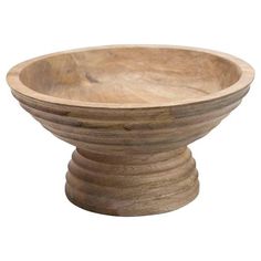 a wooden bowl sitting on top of a table