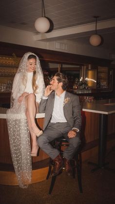 1960s Inspired Wedding by Cassie Castellaw / A short wedding dress, a bridal cape, retro hair and makeup, vintage cars, martinis, lots of spaghetti, yellow flowers, flash photography, and red lighting just like the Copacabana. 1960s Inspired Wedding, The Goodfellas, Red Lighting