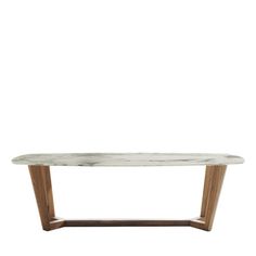 a white marble table with wooden legs