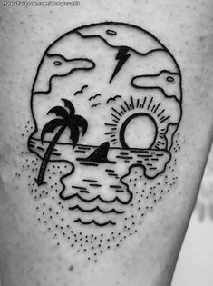 a black and white image of a skull with a beach scene on it's thigh