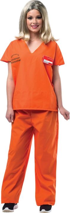 a woman in an orange prison uniform posing for the camera with her hands on her hips