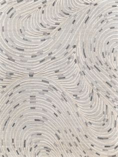 an area rug with wavy lines on it