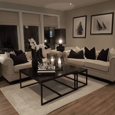 a living room filled with furniture and candles