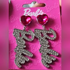 Show Off Your Love For All Things Barbie With These Drop Earrings. The Silver-Tone Design Reads "Barbie" With A Hot Pink Faux Gem Stud Base. Earrings By Barbie Drop: 2.5 In. / 6.35 Cm. Finish: Silver-Tone Closure: Post Back New Barbie Jewelry, Fandom Jewelry, Pink Heart Earrings, Vintage Stud Earrings, Barbie Kitchen, Pink Studs, Barbie Accessories, Heart Drop Earrings, Rhinestone Heart