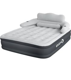 an inflatable bed with pillows on top and the mattress is attached to it