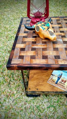 a coffee table made out of wood with a magazine on top