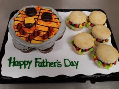 a father's day cake and cupcakes on a tray