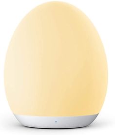 an egg shaped light is shown on a white surface