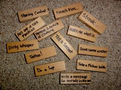 wooden name tags with words on them sitting on the floor in front of a carpet