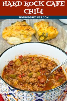 a bowl filled with chili and meat next to bread on the side, text overlay reads how to make a hard rock cafe chili