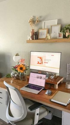 a desk with a laptop and a desktop computer on it