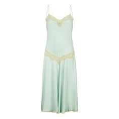 This elegant slip dress is cut from beautiful seafoam green silk and trimmed with pale off-white lace. Created by luxury lingerie label Jenny Dobell in the 1980s, it draws on classic 1920s’ silhouettes. The flared skirt kicks out as the wearer moves and delicate spaghetti straps support the lace-detailed, sweetheart neckline. A pretty, coordinating seafoam bow is placed in the middle of the chest and a panel of sheer lace encircles the waist. Modern equivalents are rarely made as well as this pi Elegant Green Slip Dress For Daywear, Vintage Silk Slip Dress With Spaghetti Straps, Vintage Lace Slip Dress For Evening, Vintage Lace Evening Slip Dress, Vintage Silk Slip Dress With Lace Trim, Elegant Slip Dress, Vintage Slip Dress, Mint Dress, Lace Nightgown