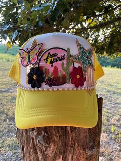 ❤️This is a yellow and white trucker hat  with 6 patches.  **The pins in the photo are just holding the patches. This hat hadn't been pressed yet so we can make adjustments for you if needed. The hat will be pressed when purchased. ** ❤️❤️ If you would like to order something custom please reach out to me before purchasing. We will discuss details and make your one of a kind hat something you will love. ❤️❤️ ❤️ Material: 100 % Polyester Hat Unique Patches ❤️Size: One Size Adult Hat  It is SnapBa Trendy Yellow Snapback Trucker Hat, Yellow Trucker Hat Baseball Cap For Spring, Trendy Yellow Snapback Baseball Cap, Adjustable Yellow Trucker Hat For Spring, Yellow Adjustable Trucker Hat For Spring, Yellow Trucker Hat For Summer, Yellow Trucker Hat For The Beach, Trendy Yellow Trucker Hat For Spring, Trendy Yellow Trucker Hat For Summer