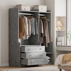 an open wardrobe with clothes hanging on the rails and drawers, next to a bed