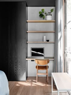 a bedroom with a bed, desk and shelves