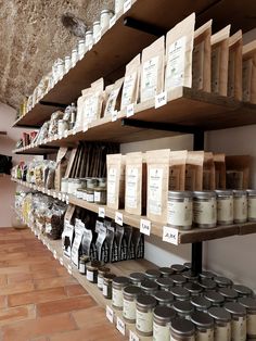 the shelves are filled with various types of spices and coffee beans, along with other items