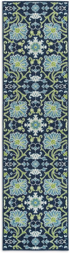 a blue and green rug with an ornate design